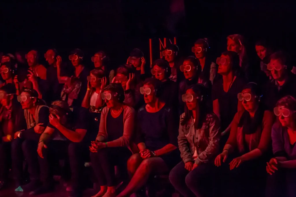 A picture from Imagine Touched, a film that offers a unique insight into the world of members from the Australian Sign Language community. The audience has their eyes covered by glasses, removing their ability to see