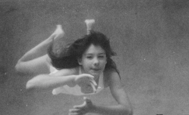 An image of a girl underwater, from the film Chlorine Dreams